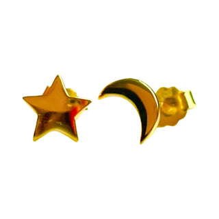 Gold star and moon earrings on a white background