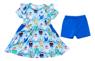 Children's dress with cartoon character pattern bears and blue shorts on a white background