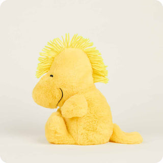 Yellow plush toy with frizzy hair on a white background