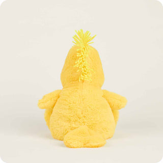 Yellow plush toy with a textured top on a white background