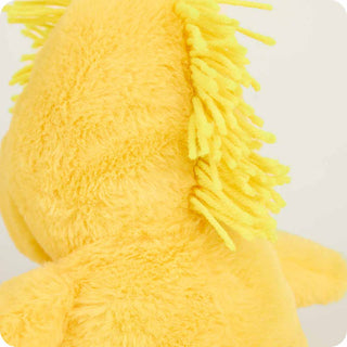 Close-up of a yellow plush toy with string hair on a white background