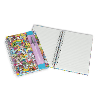 Colorful notebook with tokidoki characters and a pen on a white background