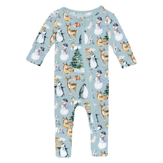 Baby onesie with winter animal pattern on a light blue background