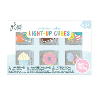 Packaging of water-activated light-up cubes with various designs on a white background