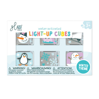 Packaging of water-activated light-up cubes with winter-themed designs on a white background.