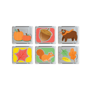 Set of six small square light up cubes with autumn-themed designs on a white background
