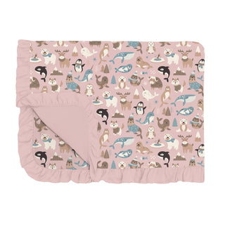 Folded blanket with a ruffle edge featuring an arctic animal print on a baby pink background.
