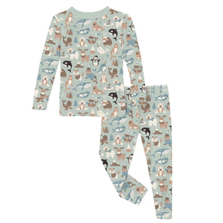 Children's pajama set with animal pattern on a light blue background