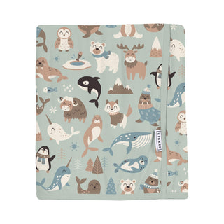 Blanket with animal pattern on a light blue background