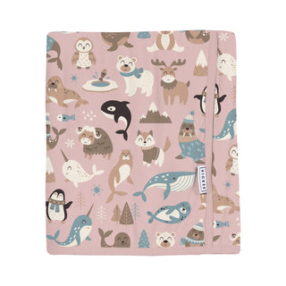 Blanket with arctic animal pattern on a pink background