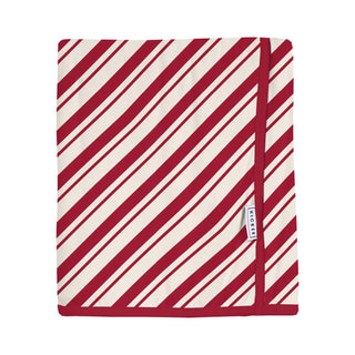 Blanket with red and white diagonal stripes on a white background