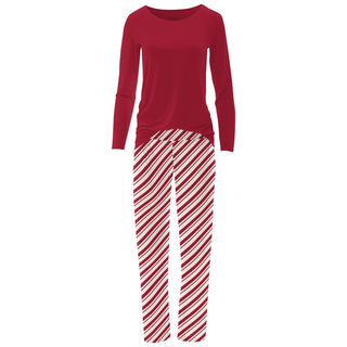 Red long-sleeve top and striped pants on a white background