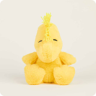 Yellow plush Woodstock with a mohawk on a white background