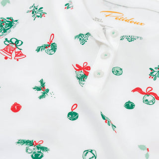 White shirt with Christmas-themed pattern featuring red and green elements on a white background.