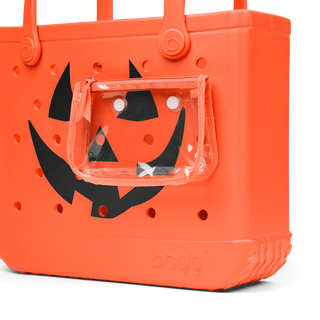 Orange bag with black jack-o'-lantern face design on a white background