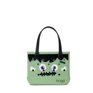 Green monster-themed bag with black accents on a white background