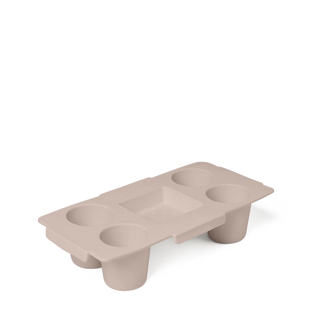 Beige plastic tray with multiple compartments on a white background