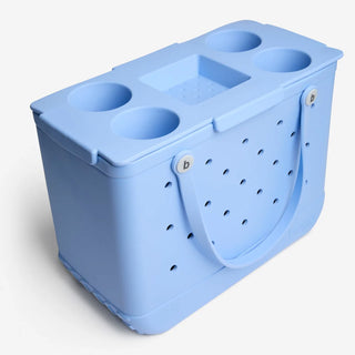 Blue bogg bag with blue tray topper and handle on a white background