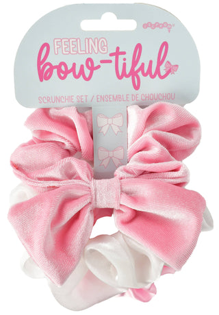 Pink scrunchie set with a bow on a white background